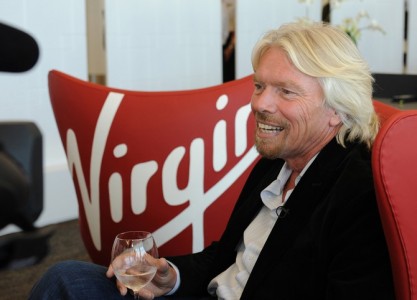 In this photo released by Virgin America Airlines, Sir Richard Branson relaxes at the new sustainable Terminal Two (T2) at San Francisco International Airport, April 6, 2011 in San Francisco., The Terminal is slated to be the first LEED ® Gold-certified terminal in the U.S. and offers features intended to improve the typical airport experience, like a stress-free “Recompose” lounge post-security, free wireless and plugs throughout, living room-like gate spaces and “moodlighting” that reflects Virgin America’s own signature cabin lighting.  The only airline headquartered at SFO, Virgin America’s growth stimulated the project and informed the T2 design process from the earliest stages.  The airline will be an anchor tenant at SFO’s T2.  (HANDOUT Photo/Virgin America Airlines, Bob Riha, Jr.)  *No Sales*